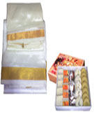 Send Pongal Gifts with Pattu Veshti with 1 Kg Assorted Sweets to Chennai Delivery.
